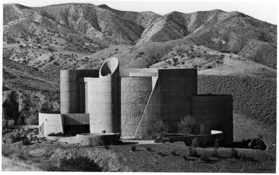 [Buildings against a backdrop of hills]